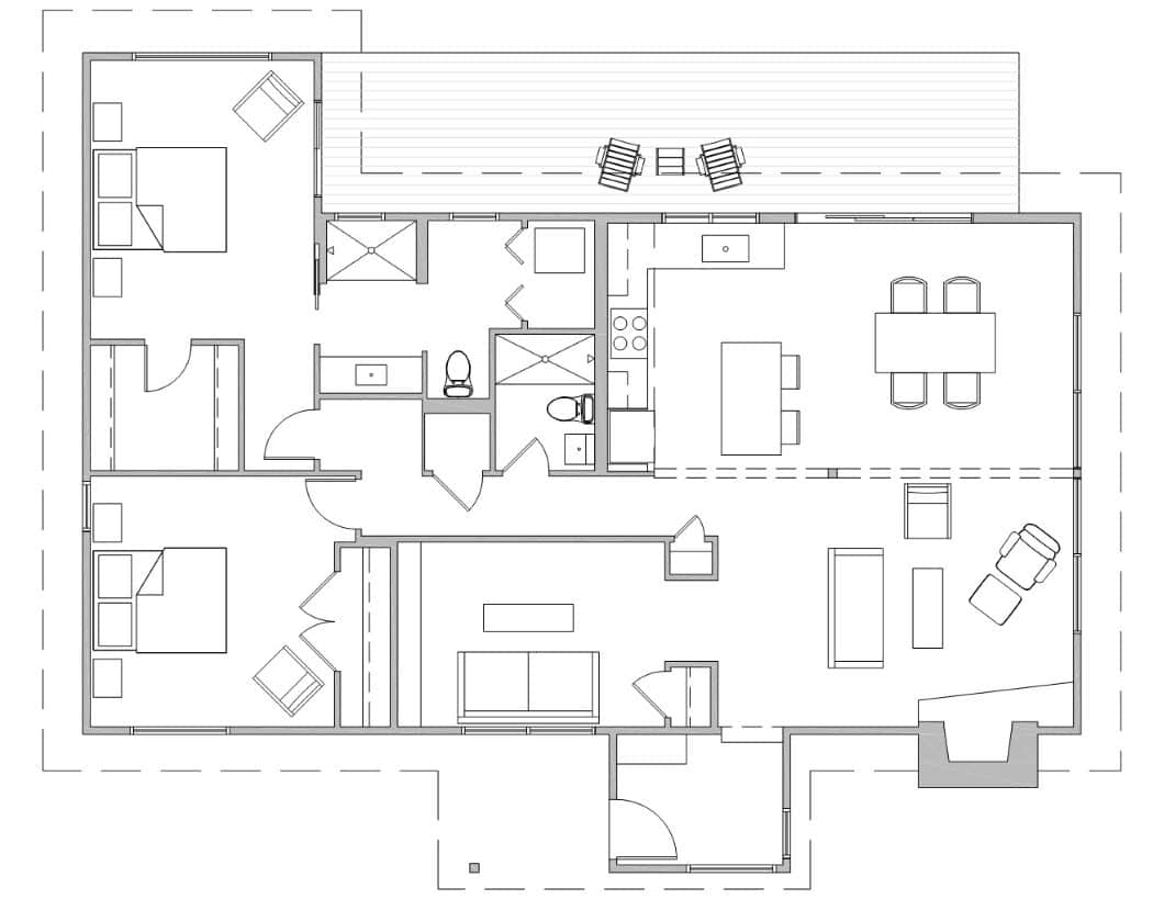 Black and white floor plan of a mid century modern home renovation in Urbana, IL, featuring three bedrooms, two bathrooms, kitchen, dining area, living room, laundry, and a back patio with chairs.